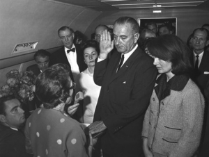 President Lyndon B. Johnson takes the oath of office aboard Air Force One, Love Field, Dallas, Texas, following  the assassination of President John F. Kennedy 22 November 1963. (Photograph by Cecil Stoughton)